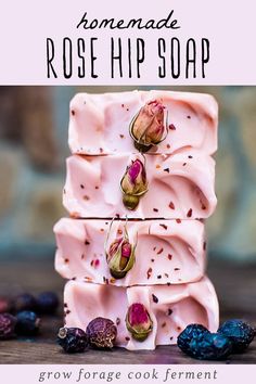 homemade rose hip soap is stacked on top of each other and surrounded by blueberries