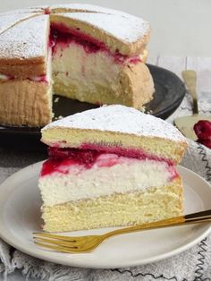 two pieces of cake on plates with forks