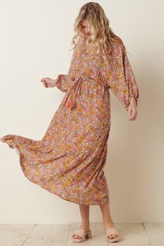 For vintage lovers and free spirits, this maxi is casual bohemian at its best. The floral print on a pink background is the perfect spring and summer color palette. Slip on this stretchy dress and go twirl in a flower field! -VINTAGE FLOWER PRINT ON WOVEN FABRIC -LOOSE FIT V-NECK -DOLMAN 3/4" LONG SLEEVE -ELASTIC WAIST WITH SPAGHETTI TIE AND CUTE TASSEL TRIM -MAXI LENGTH -100% RAYON hand wash cold, line dry model is 5'9 and wearing size small Vintage Flower Prints, Summer Color Palette, Vintage Lovers, Stretchy Dress, Summer Color, Vintage Lover, Flower Field, Flower Child, Summer Colors