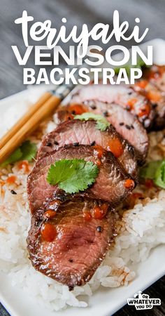 steak on rice with chopsticks and garnished with cilantro sauce