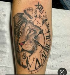 a black and white photo of a clock with a lion on it's arm