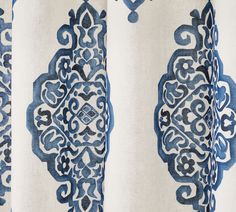 a curtain with blue and white designs on it