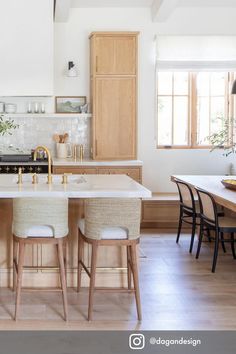 a kitchen with wooden cabinets and white counter tops next to a dining room table filled with chairs