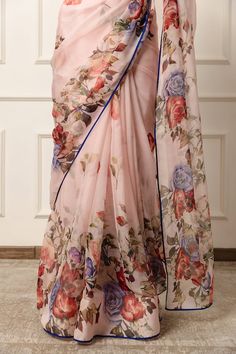 Blush pink saree featuring floral print with contrast blue piping on the hem. Comes with an unstitched blouse piece. - Aza Fashions Pink Georgette Pre-draped Saree With Floral Print, Pink Floral Pre-draped Saree In Georgette, Pink Floral Print Pre-draped Georgette Saree, Pink Floral Pre-draped Georgette Saree, Silk Pre-draped Saree In Pink With Floral Print, Designer Pre-draped Fitted Saree With Printed Border, Designer Wear Fitted Pre-draped Saree With Printed Border, Pink Silk Pre-draped Saree With Floral Print, Pink Pre-draped Saree With Printed Border For Wedding