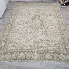 an antique rug is shown on the floor