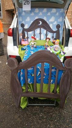 an image of a bed in the back of a car that is parked on the street