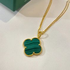 Indulge in the luxurious elegance of our Clover Malachite Gold Necklace. Crafted with a beautiful clover design and adorned with stunning malachite stones, this necklace exudes sophistication and style. Elevate any outfit and radiate confidence with this exclusive piece. ADDITIONAL INFORMATION Color: Gold Stone: Malachite Ref. 54233 Material:- 925 Sterling Silver - 18k Gold Plated- 18k Real Gold ( contact us via instagram) Our replica products are committed to quality and color when used. They a Luxury Green Malachite Necklace, Luxury Gold Emerald Necklace In Sterling Silver, Luxury Malachite Necklaces For Gifts, Luxury Green Pendant Necklace, Elegant Green Flower Pendant Necklaces, Elegant Green Flower Pendant Necklace, Luxury Green Emerald Gold-plated Necklace, Elegant Malachite Pendant Necklace, Elegant Yellow Gold Malachite Necklace