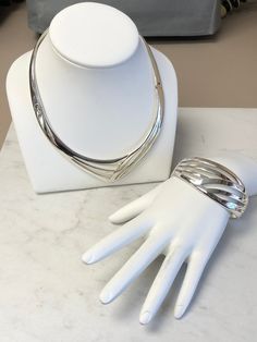 "A Beautiful Classic Sterling Silver Large Solid Bracelet and Necklace Set. The Bracelet is very solid and well-made with two hinges and a hidden clasp. The inside opening dimension is 2 1/4\". The wide is 1 1/8\" and graduated down to 5/8\" in the back. The Necklace is also solid and well-made with double hinges to open with a hidden clasp. This choker would fit for a 16\" neckline. Both of these open design pattern has a bright shiny plain polish finish. This is only sold as a set. This item w Classic Bangle Jewelry With Box Clasp, Classic Bangle With Box Clasp, Elegant Sterling Silver Jewelry With Box Clasp, Modern Hinged Bangle Jewelry, Modern Hinged Jewelry For Gifts, Modern Hinged Jewelry As A Gift, Modern Formal Jewelry, Sterling Silver Bracelet With Shiny Finish For Formal Occasions, Modern Sterling Silver Clasp Bangle