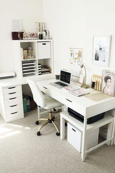 a white desk topped with a laptop computer next to a drawer filled with office supplies