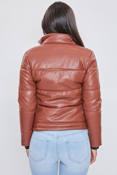 Give your Winter wardrobe a chic update with our Pleather Puffy Jacket. Feel confident while you keep warm in this trendy 100% faux leather jacket. Designed with quilted puffer construction. Featuring a mock neck, front zip closure with snap buttons, and slash pockets. Lined with faux fur to keep you extra warm and cozy! Pair this jacket with a knit sweater, jeans, and booties for a chic and edgy look, or wear with your favorite yoga pants and sneakers for a sporty vibe! Product Details- Zipper Quilted Leather Puffer Jacket, Quilted Leather Puffer Jacket With Long Sleeves, Brown Quilted Jacket With Padded Collar For Fall, Brown Quilted Leather Jacket For Winter, Quilted Leather Jacket For Winter, Leather Quilted Jacket For Fall, Winter Faux Leather Puffer Outerwear, Faux Leather Puffer Outerwear For Cold Weather, Cold Weather Faux Leather Puffer Outerwear