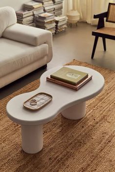 a white coffee table sitting on top of a rug