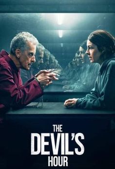 the devil's hour poster with two people sitting at a table in front of them