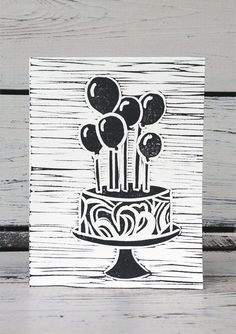 a card with balloons on top of a cake