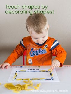 a young boy sitting at a table with scissors in front of him and the words teach shapes by decorating shapes