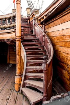 an old wooden staircase in the middle of a building