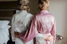 two women in matching robes standing next to each other