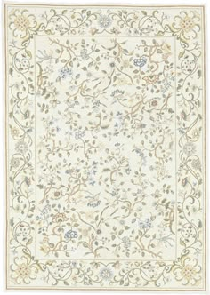 a white rug with flowers and vines on the bottom, in front of a white background