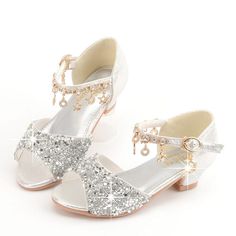 A must-have for your little girl's tutus, ballerinas and another fancy get-up. These glitter shoes are great for any occasion. The shoes are designed with an anti-slip Rubber sole, heel high 1.5 Inches These girls’ open-toe sandals with buckle closure, are easy for kids to take on or off. Great wedding flower girls shoes, Super comfortable, perfect for school, party, wedding or daily wear. Good to match with dress, jeans or other daily clothes Upper Material: PULining Material: PULeather Style: Girls Glitter Shoes, Sequin Sandals, Sequin Shoes, Flower Girl Shoes, Glitter Flats, Sparkly Shoes, Girls Heels, Costume Shoes, Bling Shoes