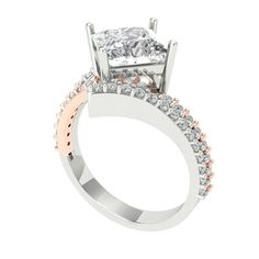 a diamond engagement ring with two tone gold and white diamonds on the band, set in 18k rose gold