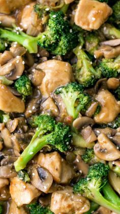 chicken and broccoli stir fry with sesame seeds in a skillet, ready to be eaten