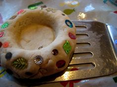 a piece of cake sitting on top of a metal spatula next to a fork