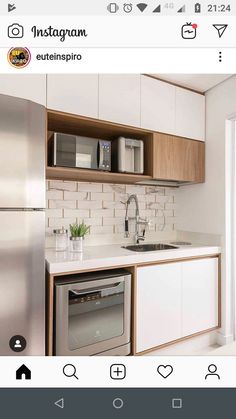 a kitchen with white cabinets and stainless steel appliance on the left hand side