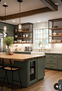 a kitchen with wooden floors and green cabinets, wood counter tops, and open shelving