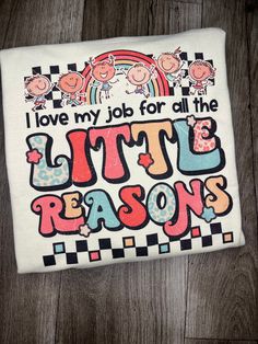 i love my job for all the little reason t - shirt on wood flooring