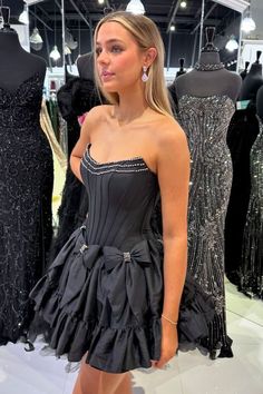 Strapless Black Beaded Short Cocktail Dress with Bow Black Strapless Evening Dress With Corset Back, Elegant Corset With Sweetheart Neckline For Gala, Elegant Sweetheart Neckline Corset For Gala, Party Dress With Satin Bow, Ball Gown Shape, Party Dress With Satin Bow Ball Gown, Black Corset Dress For Gala During Prom Season, Elegant Corset For Gala And Prom Season, Elegant Sweetheart Neckline Corset For Prom Season, Strapless Mini Dress With Bow For Gala