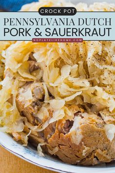 a white plate topped with meat and sauerkraut