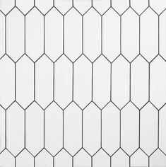 a white tiled wall with black lines on it