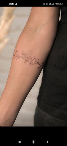 a woman with a tattoo on her arm