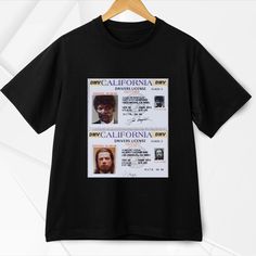 a black t - shirt with an image of two men's faces on it