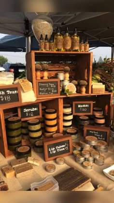 an outdoor market with lots of food on display