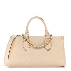 This is an authentic LOUIS VUITTON Empreinte Monogram Giant OnTheGo East West in Creme. This chic handbag is finely crafted of monogram empreinte leather embossed with a tonal giant monogram motif in a shade of cream. The bag features rolled leather top handles, an optional leather shoulder and gold chain strap. The top zipper opens to a fabric interior with a patch pocket. Louis Vuitton Pochette Metis, Louis Vuitton Crossbody Bag, Louis Vuitton Crossbody, Louis Vuitton Empreinte, Mini Pouches, Lv Monogram, Chic Handbags, Louis Vuitton Shoulder Bag, East West