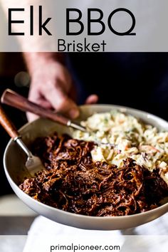 a close up of a bowl of food with meat and coleslaw in it