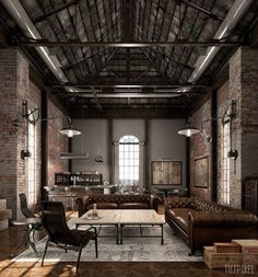 an industrial living room with brick walls and exposed ceilings, leather couches and chairs