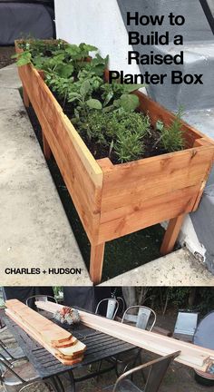 a wooden planter box sitting on top of a table next to a metal bench