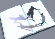 an open book with the shadow of two people and a dog on it's cover