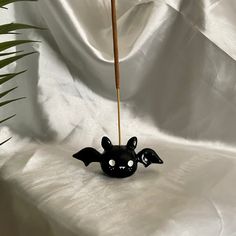 a toothbrush holder with a bat on it