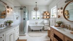 a white bathroom with two sinks and a tub