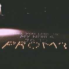 someone wrote this message on the ground in front of a building at night time,