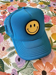 Our Smiley Face Trucker Hat is sure to bring a smile to everyone you pass by! Comfortable, breathable, and adjustable--one size fits most. Colors being restocked as quickly as possible. Keep smiling! Fun Blue Snapback Hat With Flat Brim, Blue Fun Style Snapback Hat, Adjustable Smiley Face Cap, Fun Blue Adjustable Snapback Hat, Fun Blue Trucker Hat, Fun Blue Flat Brim Baseball Cap, Fun Blue Snapback Hat, Fun Blue Visor Baseball Cap, Blue Fun Baseball Cap One Size