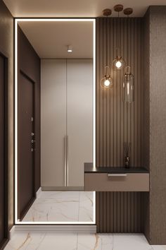 a modern bathroom with marble flooring and lights on the wall, along with an illuminated mirror