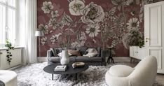 the living room is decorated with floral wallpaper