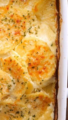 a casserole dish filled with potatoes and cheese