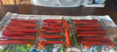 there are many carrots on the grill ready to be cooked