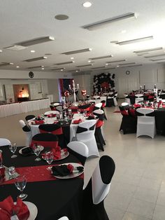 a banquet room with black and white tables