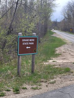 there is a sign that says grand mere state park on the side of the road