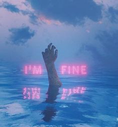 a giant hand rising out of the water with neon lights above it that says i'm fine